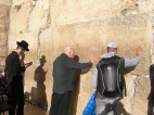 A close up shot of Fr. Keenan praying at the Western Wall. All are welcome but a yarmulke is required to cover one’s head.
